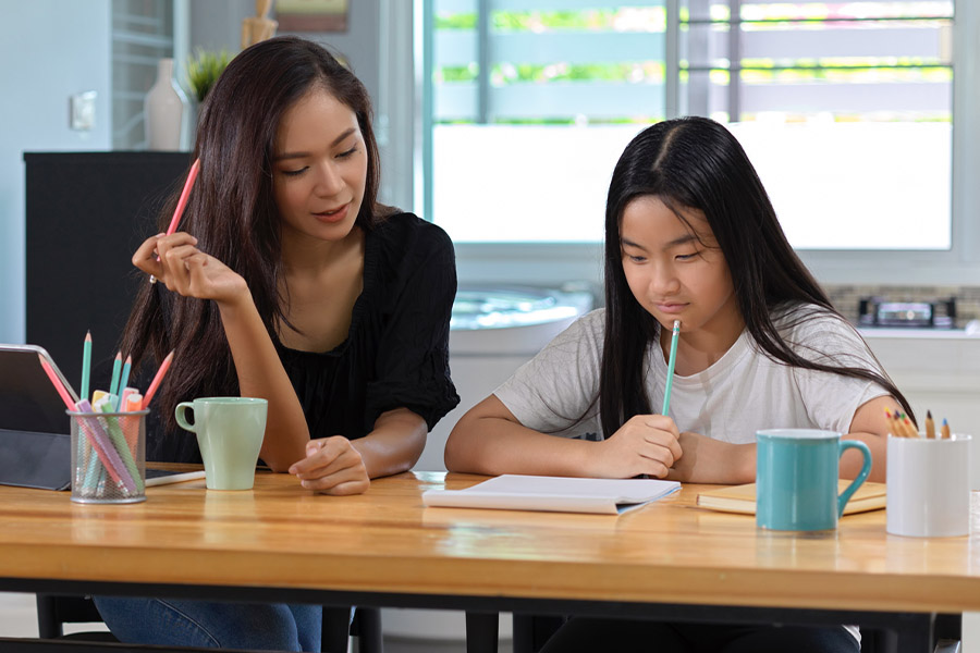 student and tutor together at a desk in Jacksonville